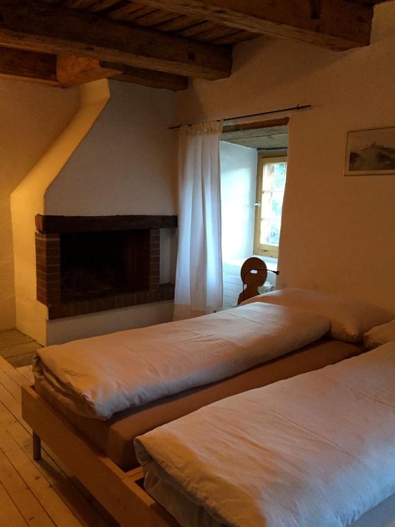 Postel nebo postele na pokoji v ubytování Hotel Alpina