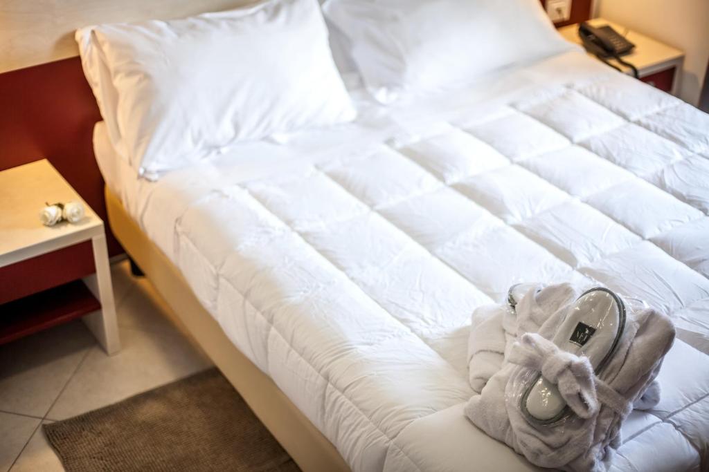 Postel nebo postele na pokoji v ubytování Hotel Oceanomare