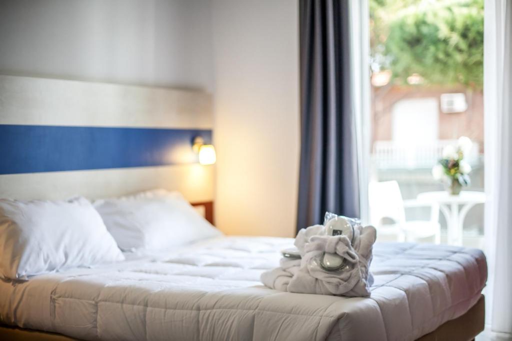 Postel nebo postele na pokoji v ubytování Hotel Oceanomare