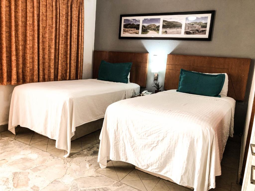 Postel nebo postele na pokoji v ubytování Hotel River Poliforum