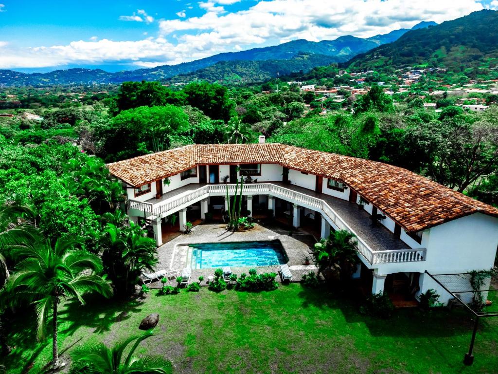 an aerial view of a house with a swimming pool at Canal Grande Lodge in Piedades