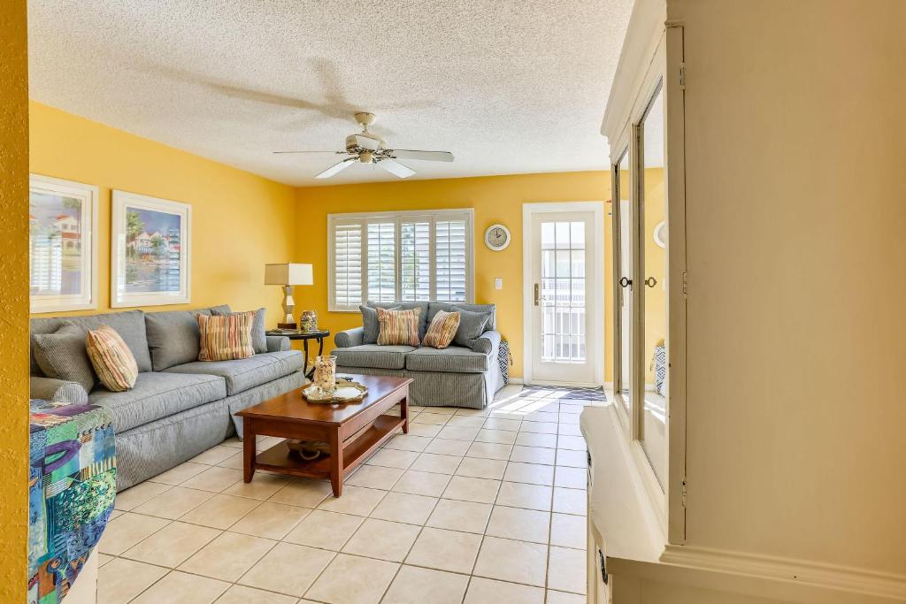 a living room with a couch and a table at Gulfside Villas 6 in Clearwater Beach