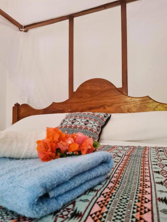 Postel nebo postele na pokoji v ubytování Beachfront Villa Ladha ya Zanzibar