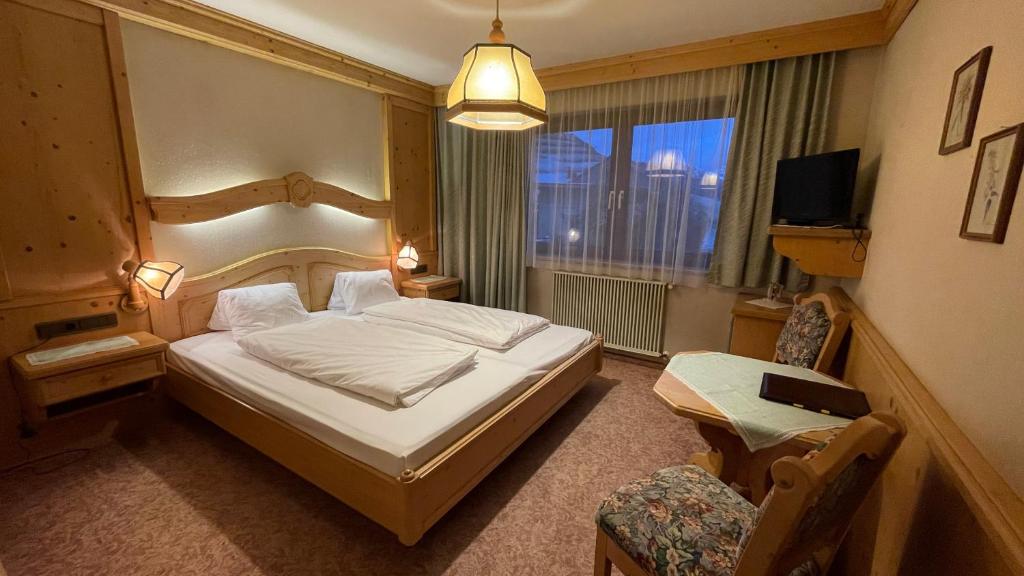 Voodi või voodid majutusasutuse Hotel Alpenrose toas