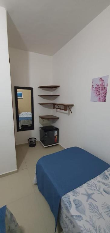 Postel nebo postele na pokoji v ubytování Pousada Sakura Rio Mar