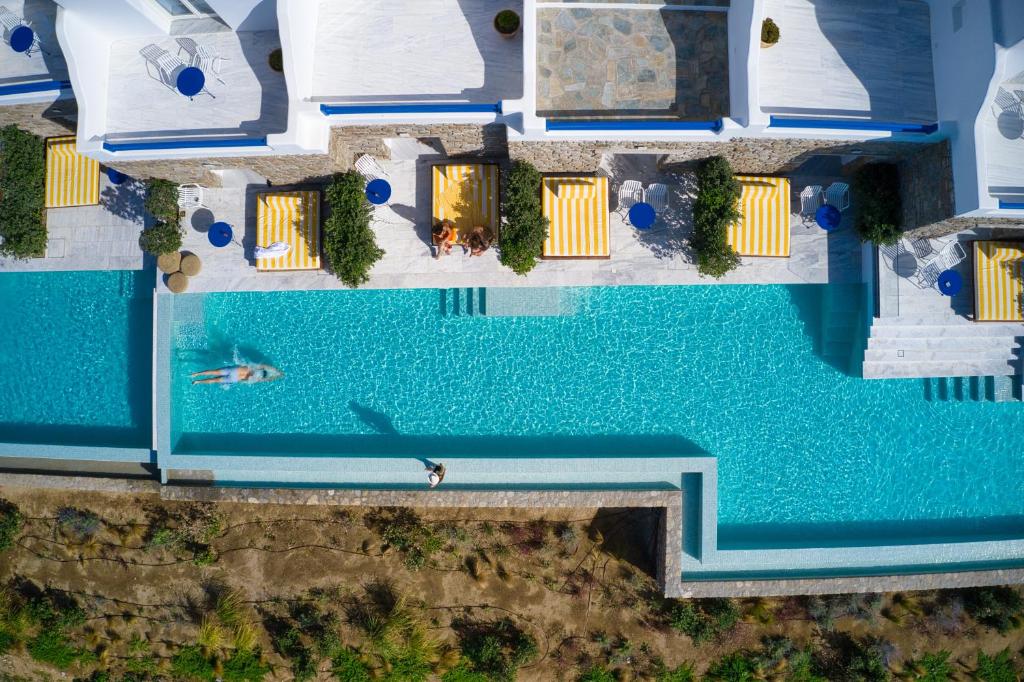 an overhead view of a swimming pool in a villa at San Antonio Summerland in Mýkonos City