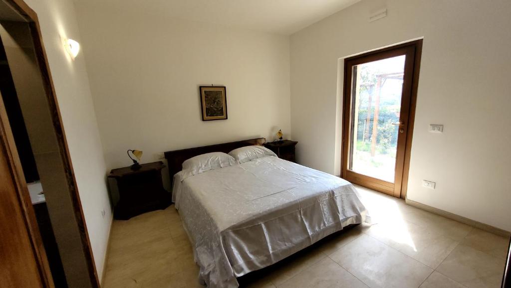 Posteľ alebo postele v izbe v ubytovaní Agriturismo Poggio la Lodola