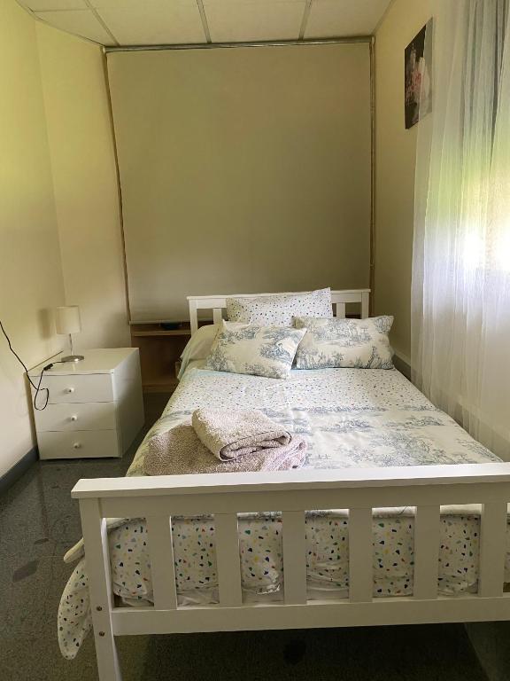 Postel nebo postele na pokoji v ubytování Villa Bimba, alojamiento con piscina y barbacoa