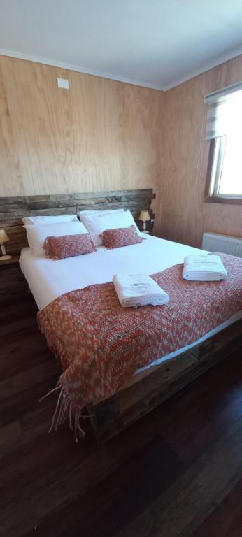 Postel nebo postele na pokoji v ubytování Cabañas Sierra Dorotea