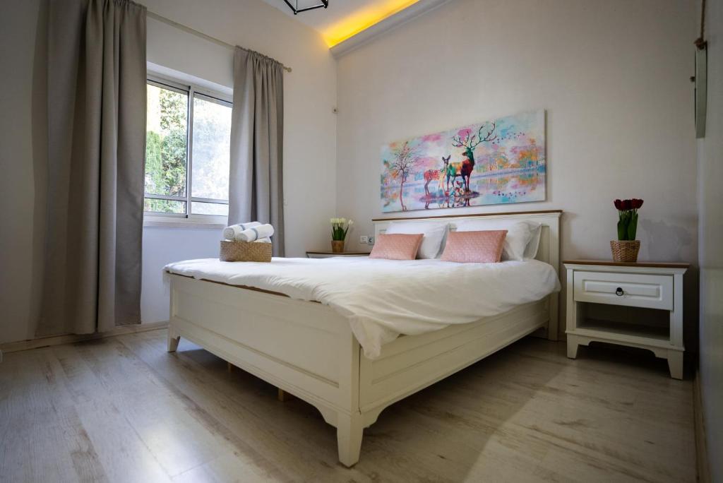 Postel nebo postele na pokoji v ubytování Villa Magnolia in Manot