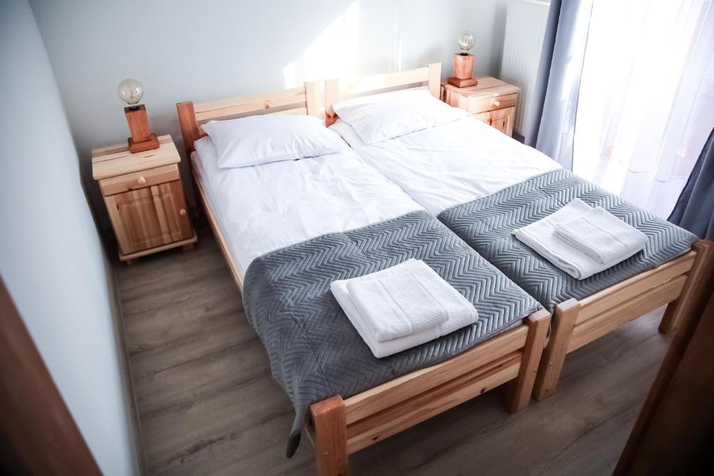 Postel nebo postele na pokoji v ubytování Gościniec Smrekowa Chata