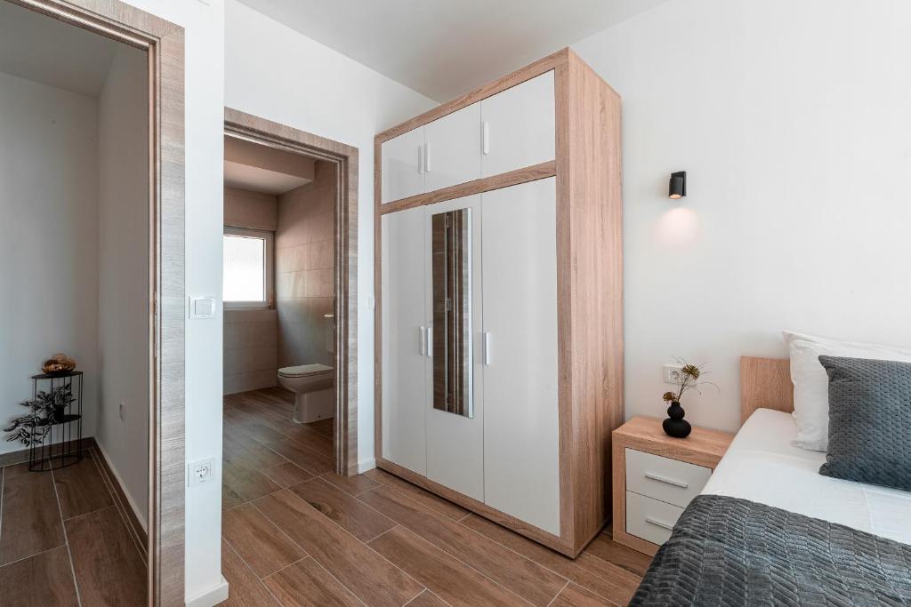 Postel nebo postele na pokoji v ubytování Korkyra Seashell