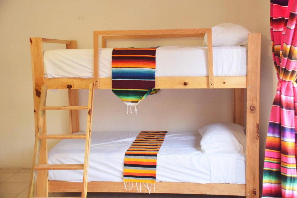 Postel nebo postele na pokoji v ubytování Hostal Casa Bohemia