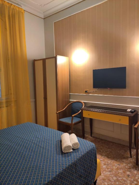 Postel nebo postele na pokoji v ubytování Hotel Milazzo Roma