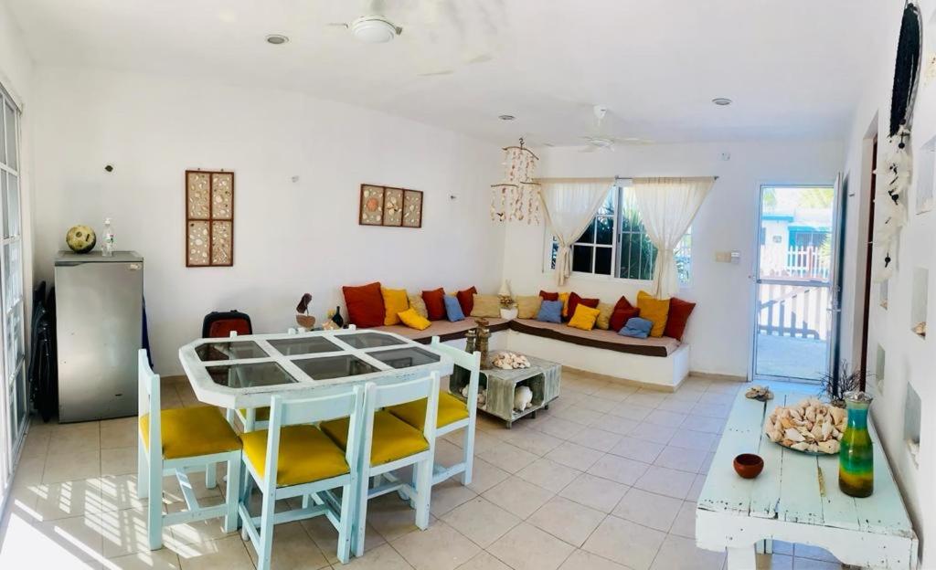 a living room with a couch and a table at Casa yuya in Chicxulub