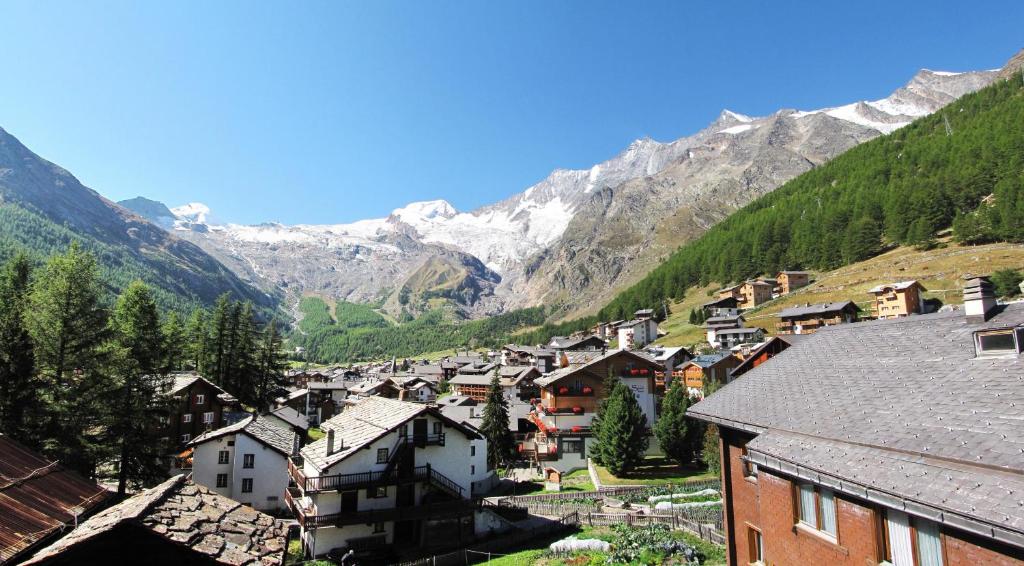 a town in a valley with mountains in the background at Adora in Saas-Fee