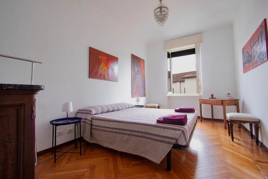 En eller flere senge i et værelse på Casa D'artista - charming apartment + Parking