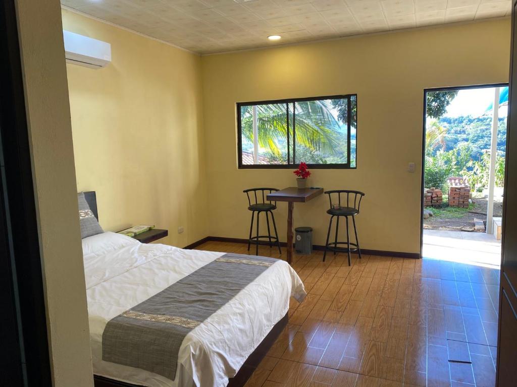 Postel nebo postele na pokoji v ubytování Villa Garita Inn