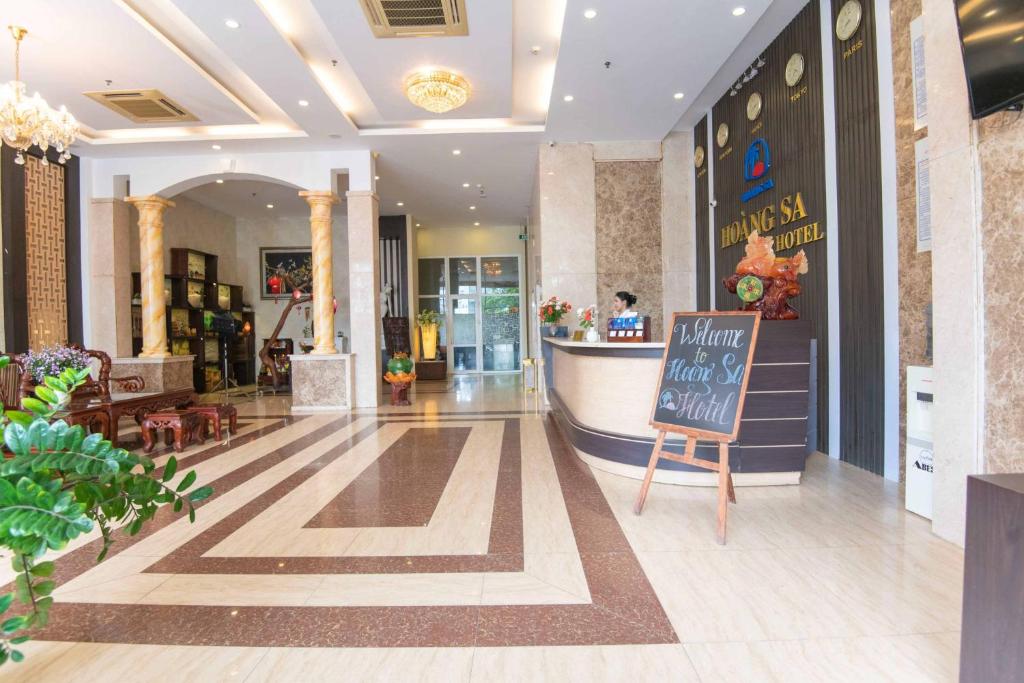 a lobby of a store with a chalkboard in the middle at Hoang Sa Hotel in Danang