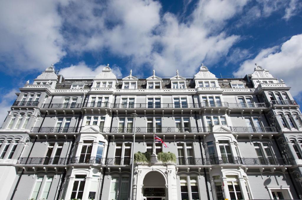 a large white building with a flag on it at The Ampersand Hotel in London