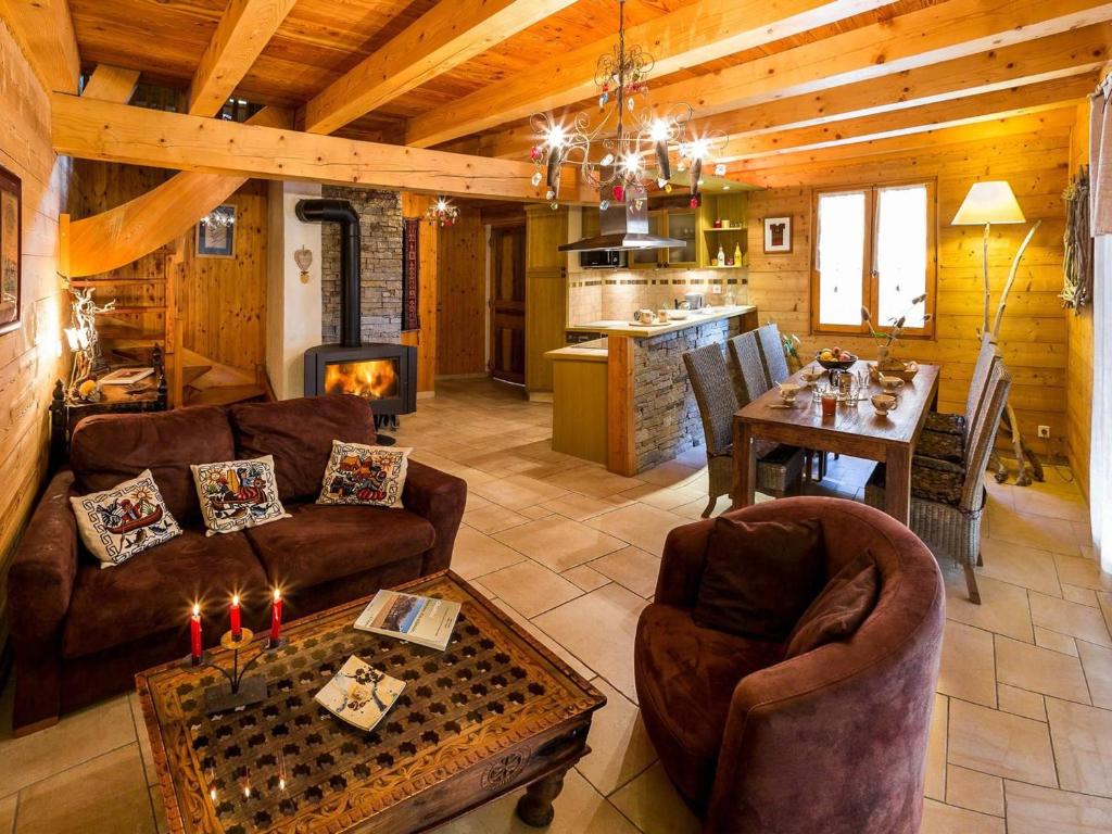 a living room with a couch and a table in a cabin at Chalet Saint-Michel-de-Chaillol, 3 pièces, 6 personnes - FR-1-393-16 in Saint-Michel-de-Chaillol
