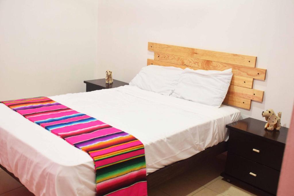 Postel nebo postele na pokoji v ubytování Hostal Casa Bohemia
