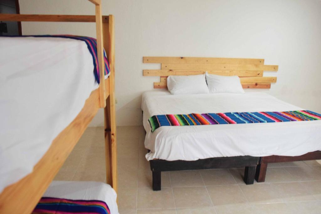 Postel nebo postele na pokoji v ubytování Hostal Casa Bohemia