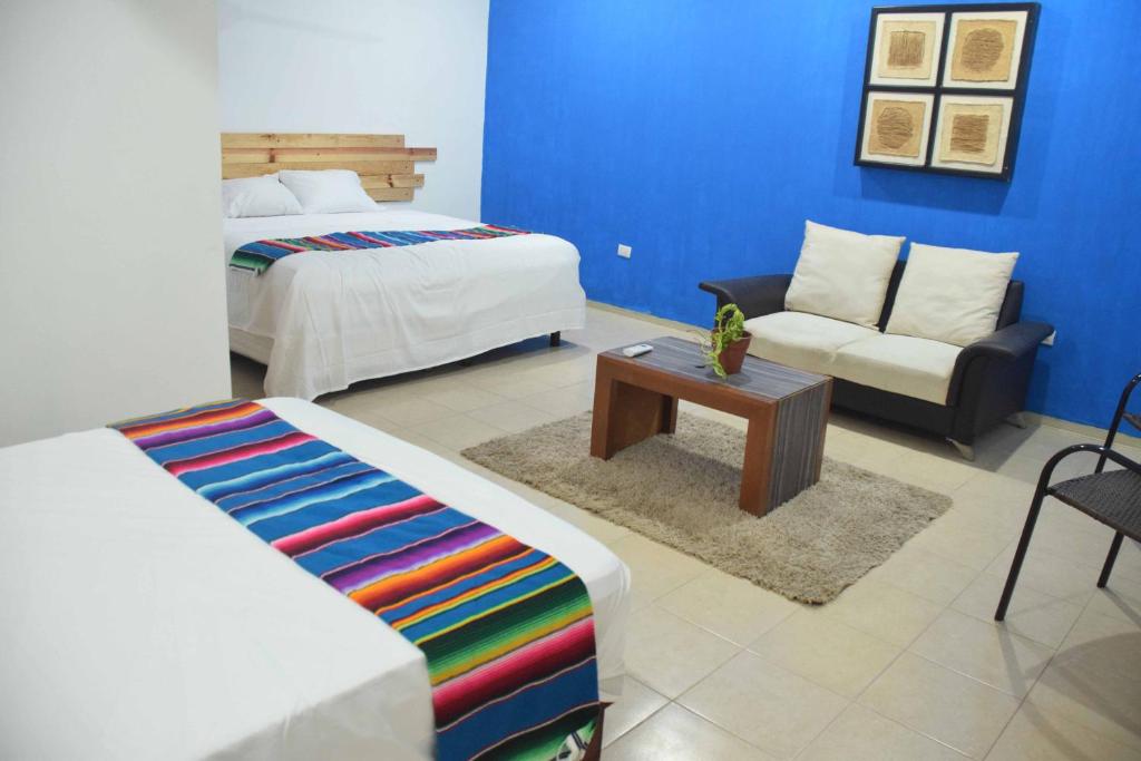 Postel nebo postele na pokoji v ubytování Hostal Casa Bohemia