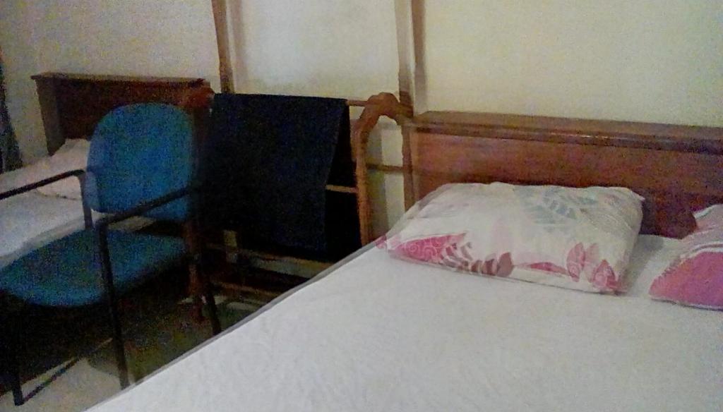 Postel nebo postele na pokoji v ubytování Leaf Guest House