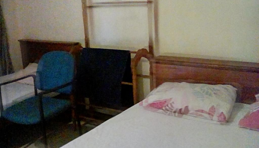 Postel nebo postele na pokoji v ubytování Leaf Guest House