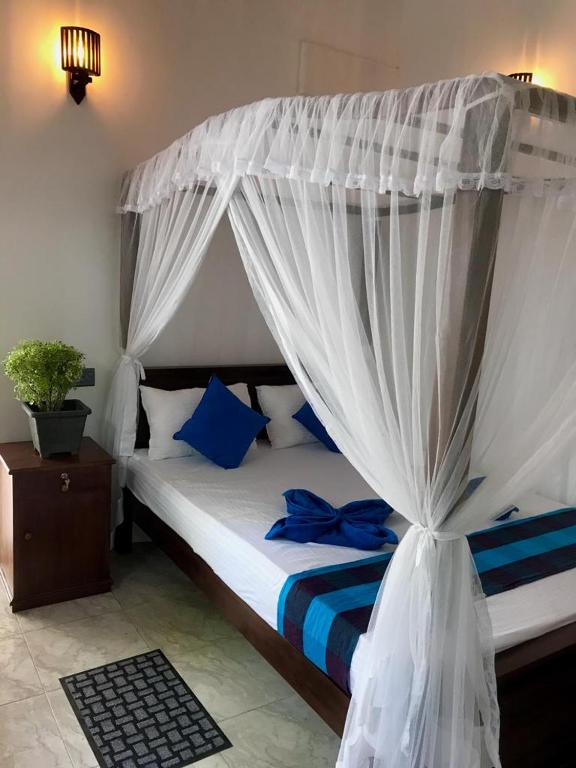 Postel nebo postele na pokoji v ubytování Bisandu guesthouse