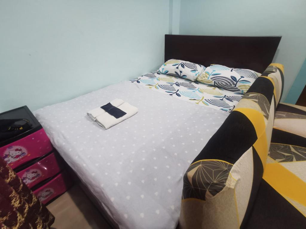 Postel nebo postele na pokoji v ubytování EZ & V Guesthouse