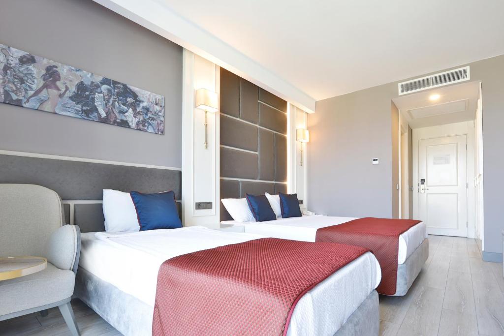 Postel nebo postele na pokoji v ubytování Hane Sun Elite Hotel