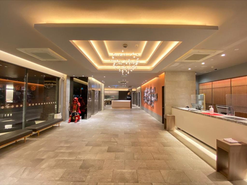 a lobby of a store with a long hallway at Noku Osaka in Osaka