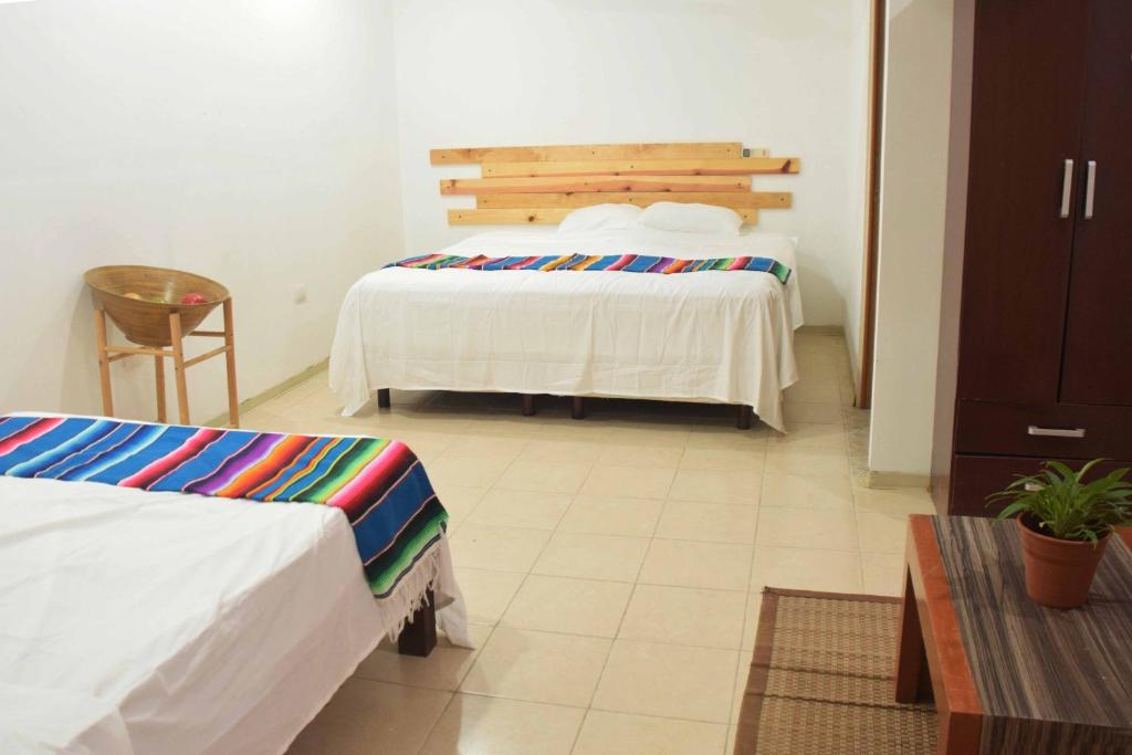 Postel nebo postele na pokoji v ubytování Hostal Casa Bohemia