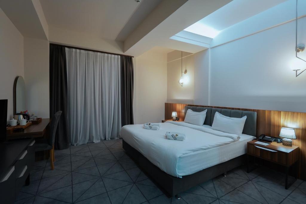 Postel nebo postele na pokoji v ubytování Bushi Resort & SPA