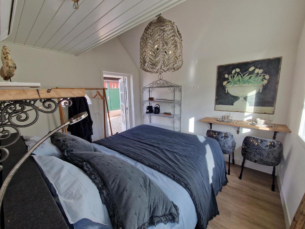 Postel nebo postele na pokoji v ubytování Bed & Breakfast Hoeve Happiness - ontbijt inbegrepen - wellness aanwezig