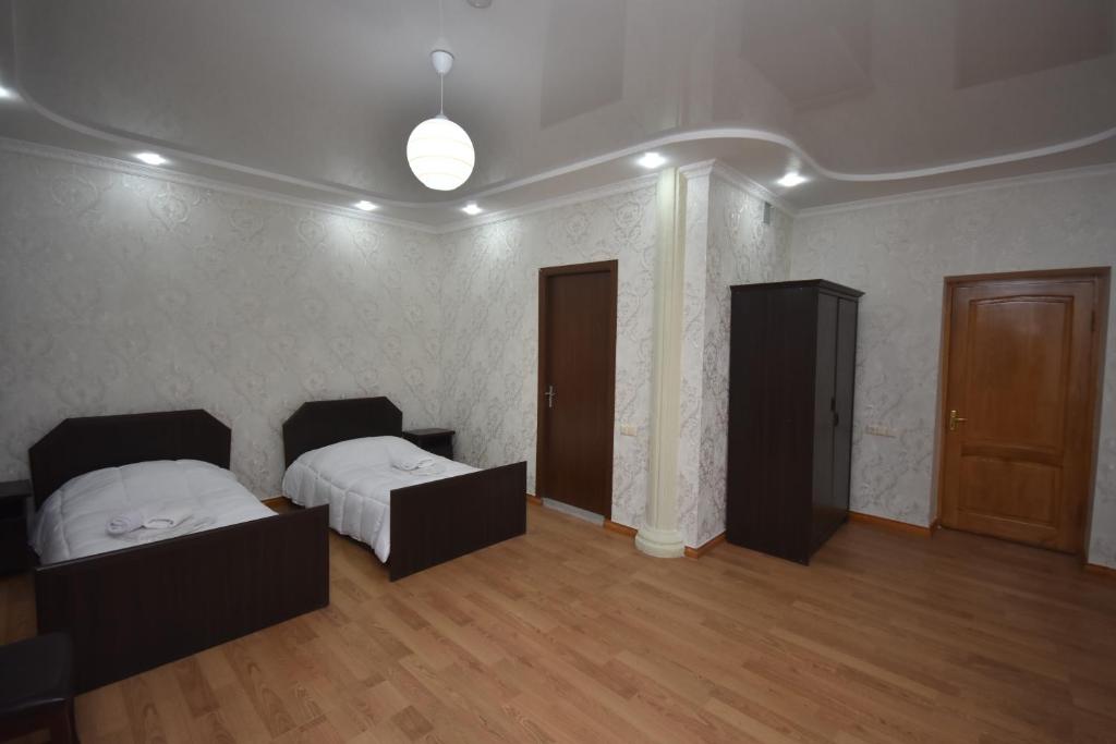 Postel nebo postele na pokoji v ubytování HOTEL SAMEGRELO