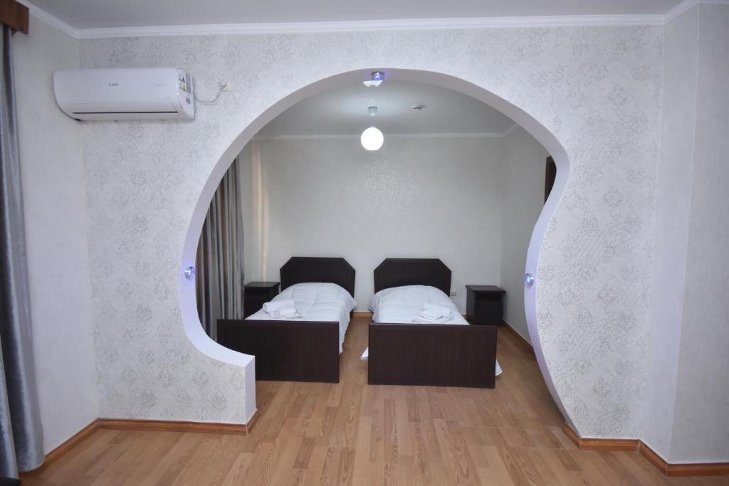 Postel nebo postele na pokoji v ubytování HOTEL SAMEGRELO
