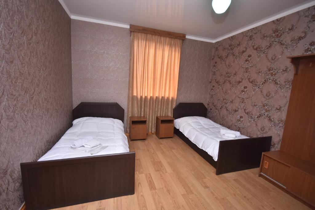 Postel nebo postele na pokoji v ubytování HOTEL SAMEGRELO