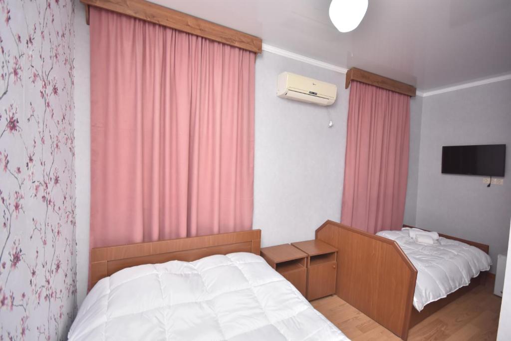 Postel nebo postele na pokoji v ubytování HOTEL SAMEGRELO
