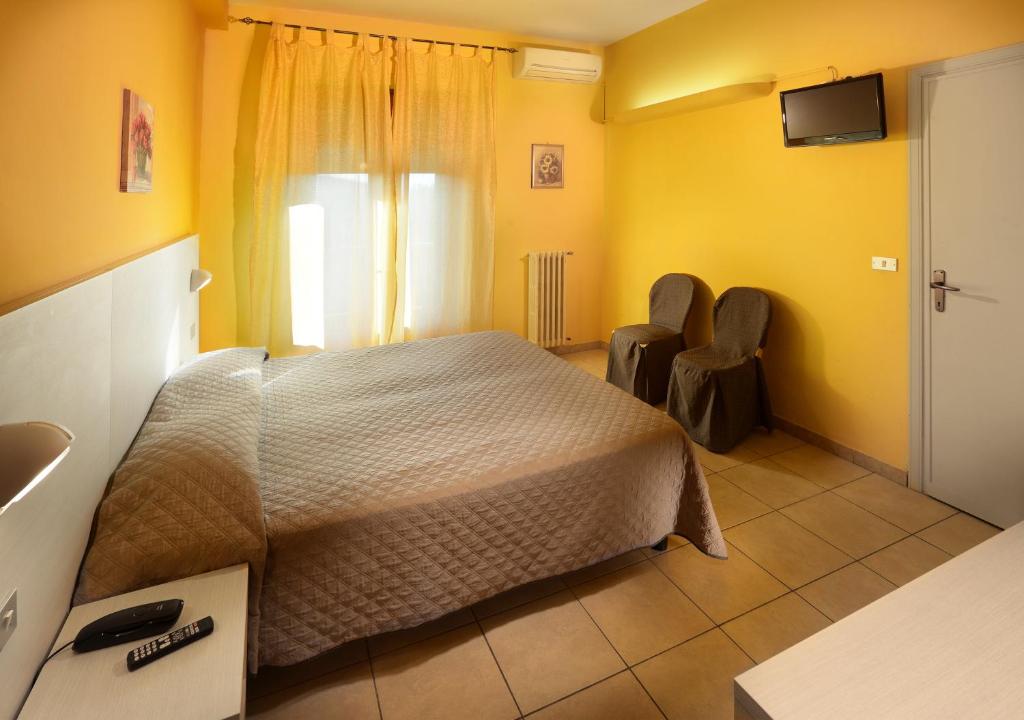 Postel nebo postele na pokoji v ubytování Hotel La Querceta