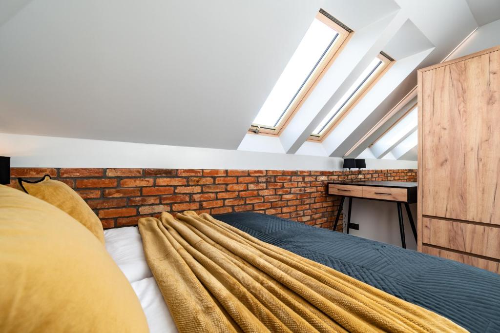 Postel nebo postele na pokoji v ubytování Family Resort Ustka - Domki dwupoziomowe z basenem