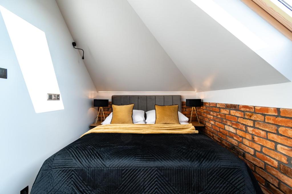 Postel nebo postele na pokoji v ubytování Family Resort Ustka - Domki dwupoziomowe z basenem