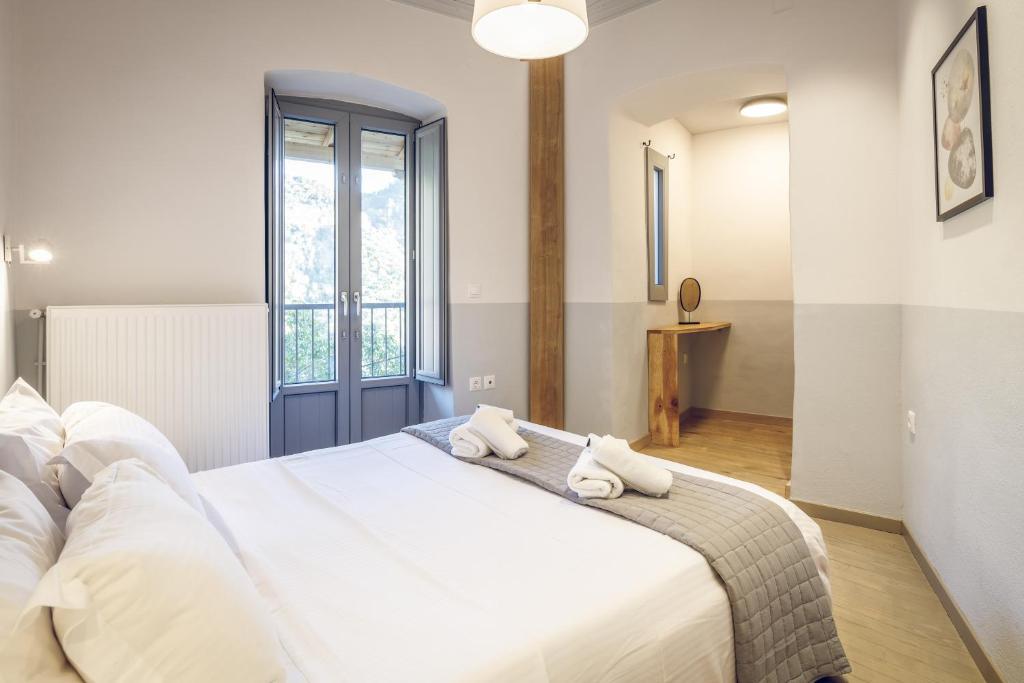 Posteľ alebo postele v izbe v ubytovaní Gileri eco & design Residences