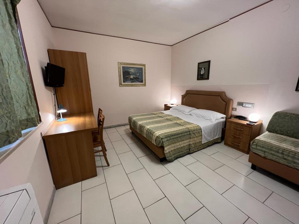 Postel nebo postele na pokoji v ubytování HOTEL MARE PINETA