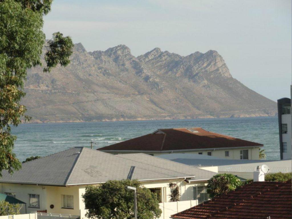 a view of the ocean and a mountain at Ocean Elephant Beach Apartment in Strand