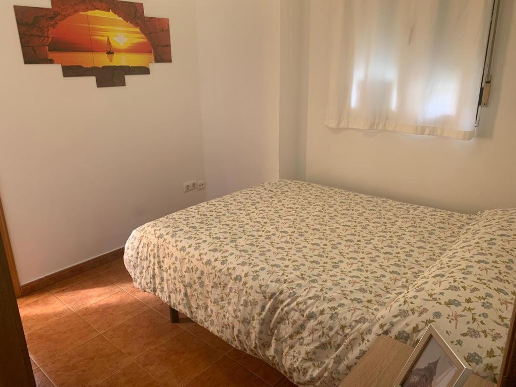 a bedroom with a bed in a room at Apartamento Talavera in Talavera de la Reina