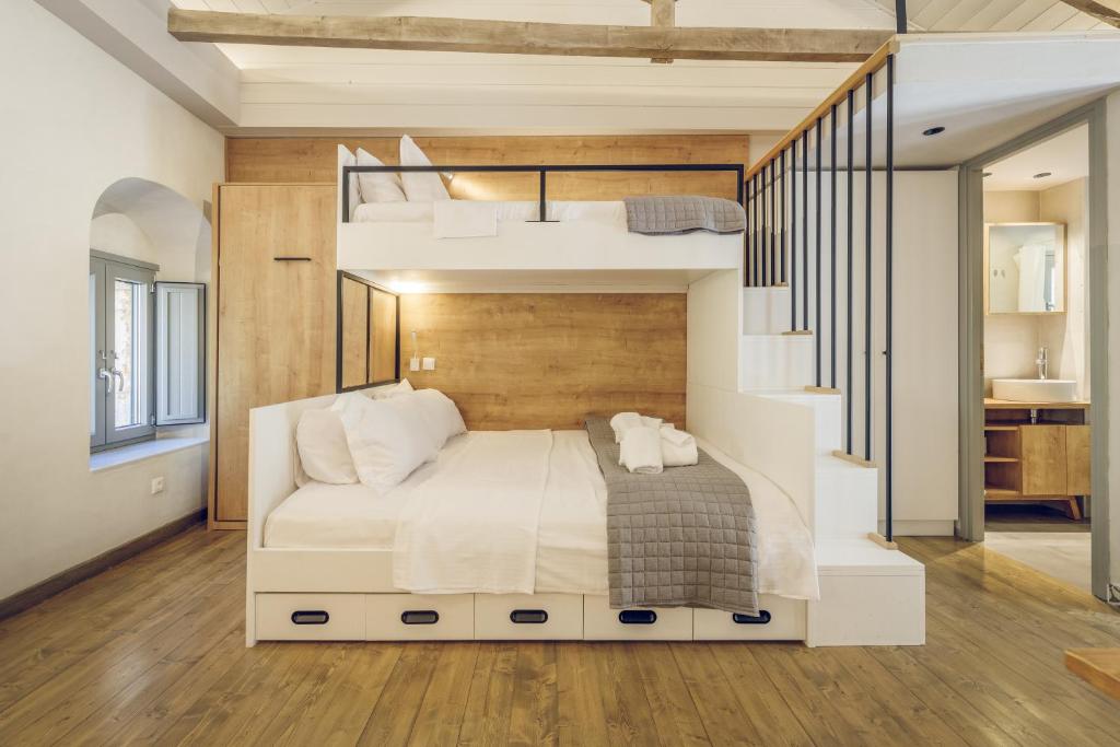 Posteľ alebo postele v izbe v ubytovaní Gileri eco & design Residences