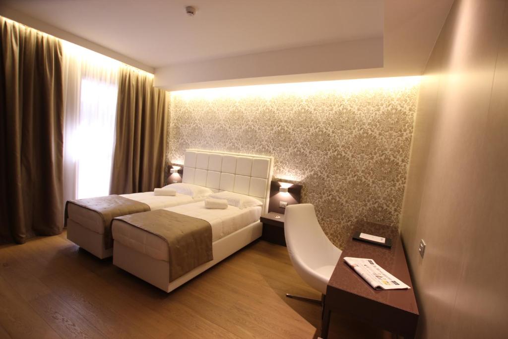 Posteľ alebo postele v izbe v ubytovaní Mokinba Hotels Baviera